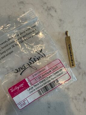 thirty-one Antique Gold Celebrate Stamp Charm